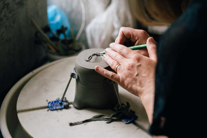 Turning a jug on potter's wheel