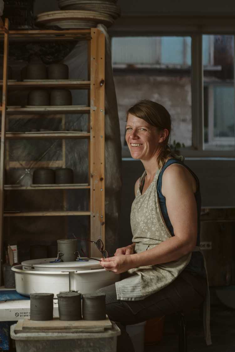 Karen Dawn Curtis sitting pottery wheel