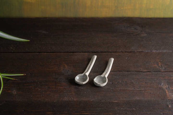 two handmade ceramic spoons