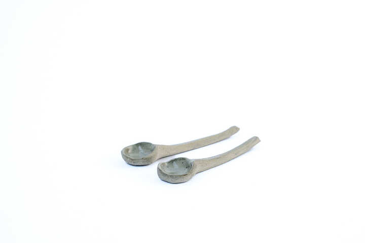 two handmade ceramic spoons