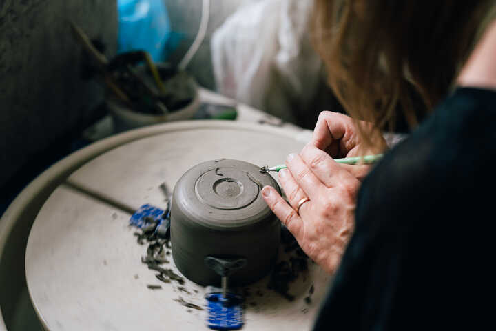 Potter turning on pottery wheel