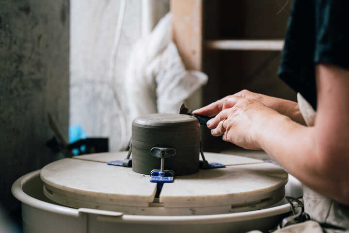 Turning a Cup on potter's wheel