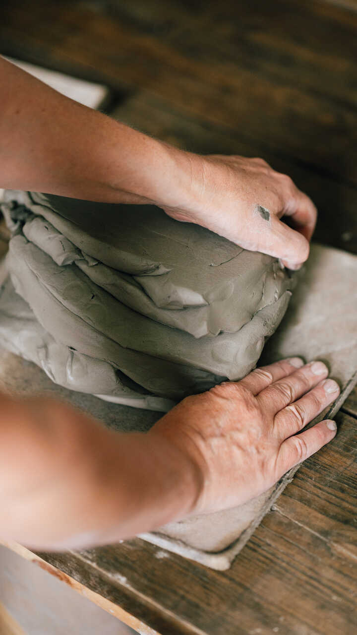 Potter preparing clay